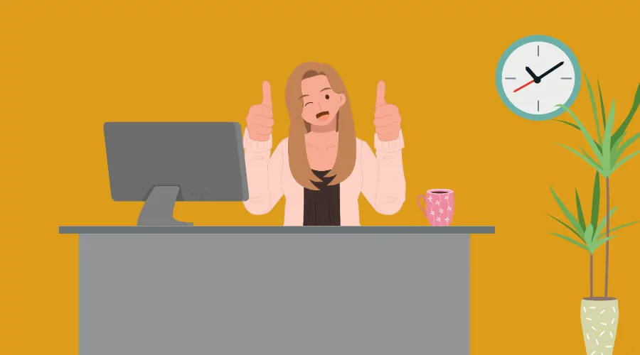 Smiling employee at desk with thumbs up